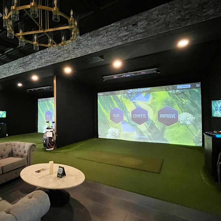 Two golf simulator bays at Tees & Taps Orchard Park