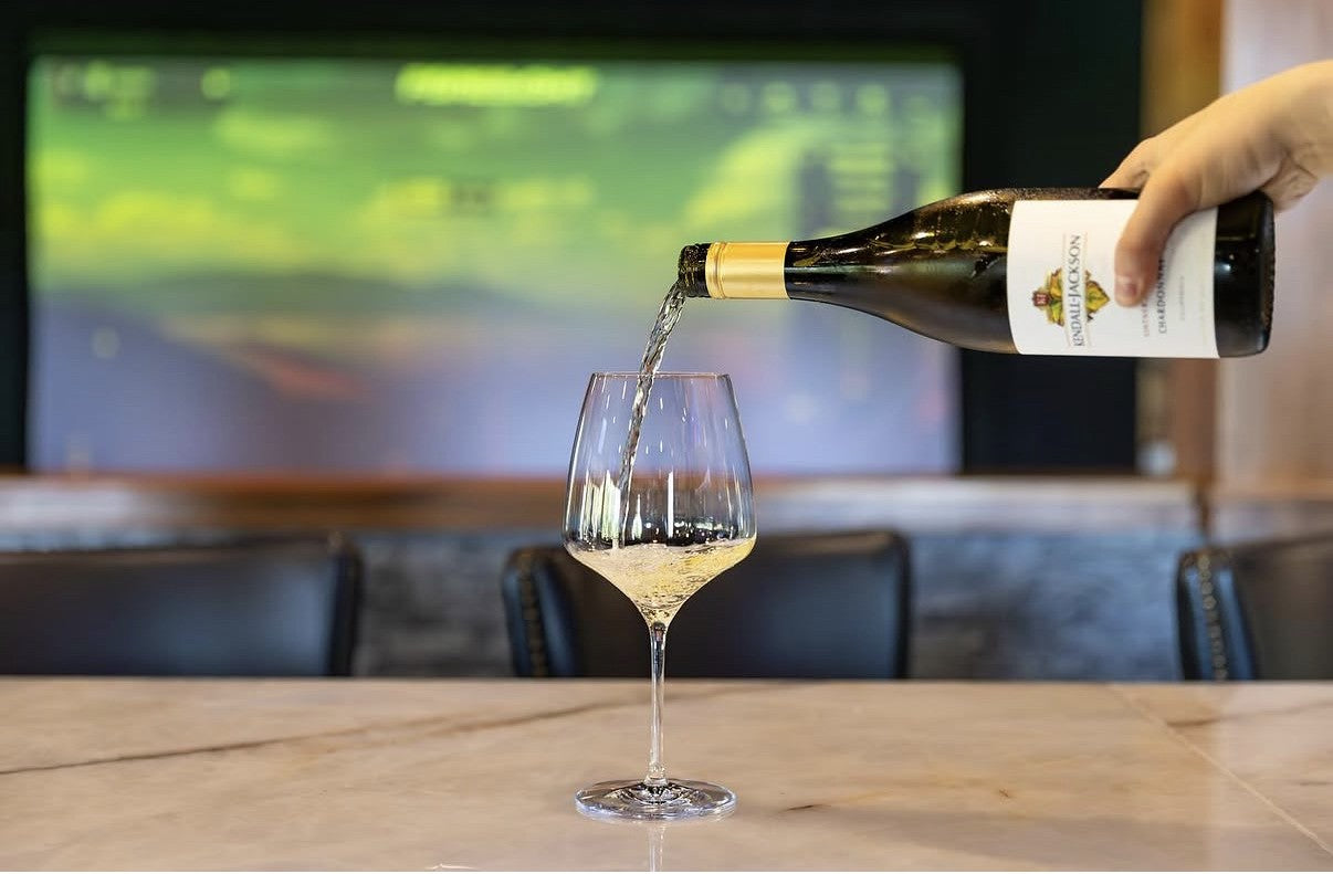 Wine being poured at Tees and Taps